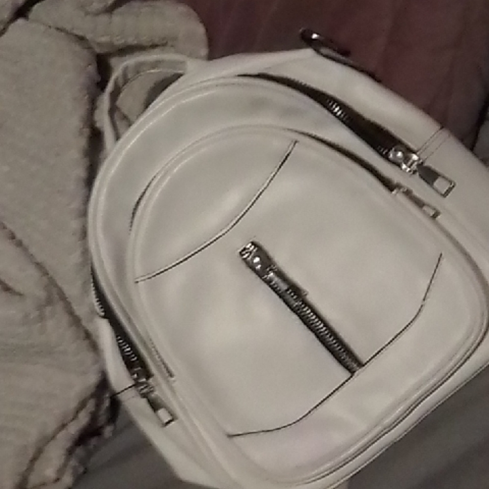 Stylish White Backpack with Zipper Details